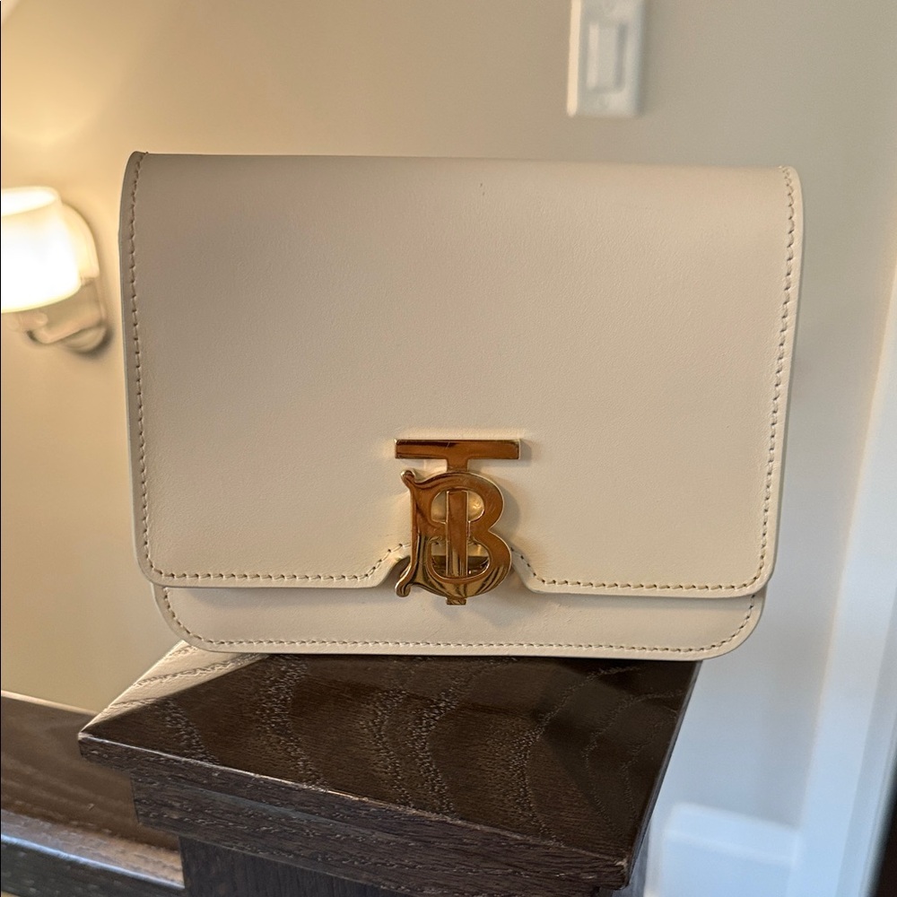 Authentic Burberry Cream Clutch with Gold Accent